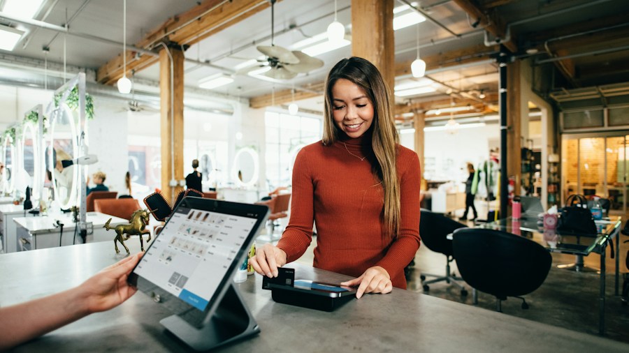 cashier scanning item receipt