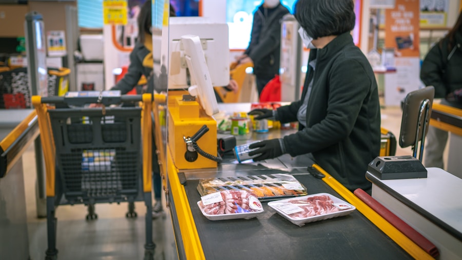 customer at grocery store register