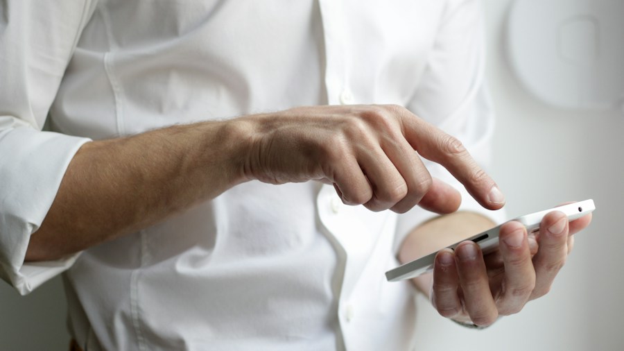 customer using smartphone for price comparison