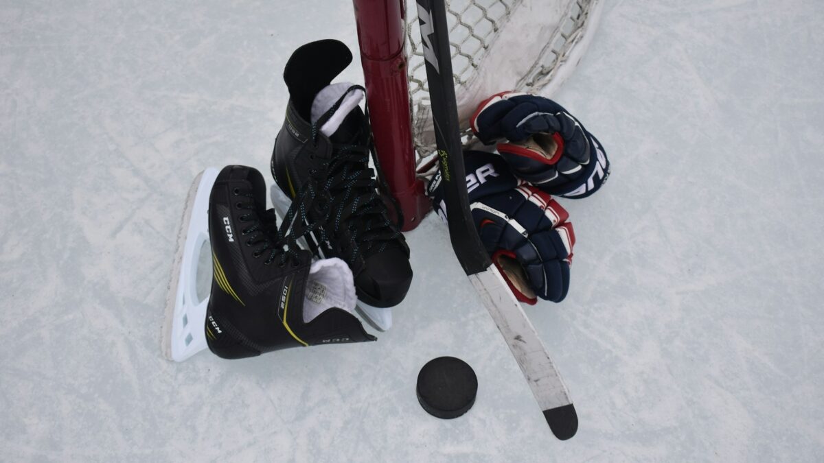 family buying hockey equipment store