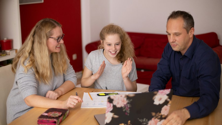 Family discussing household budget finances