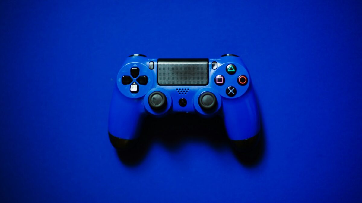 gamer holding blue controller
