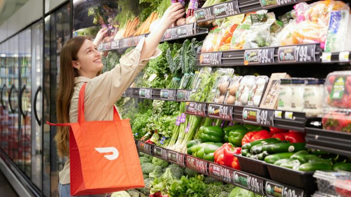 grocery shopper comparing deals