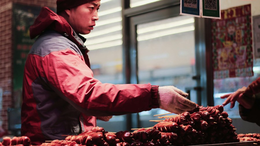 person selecting frozen berries at store