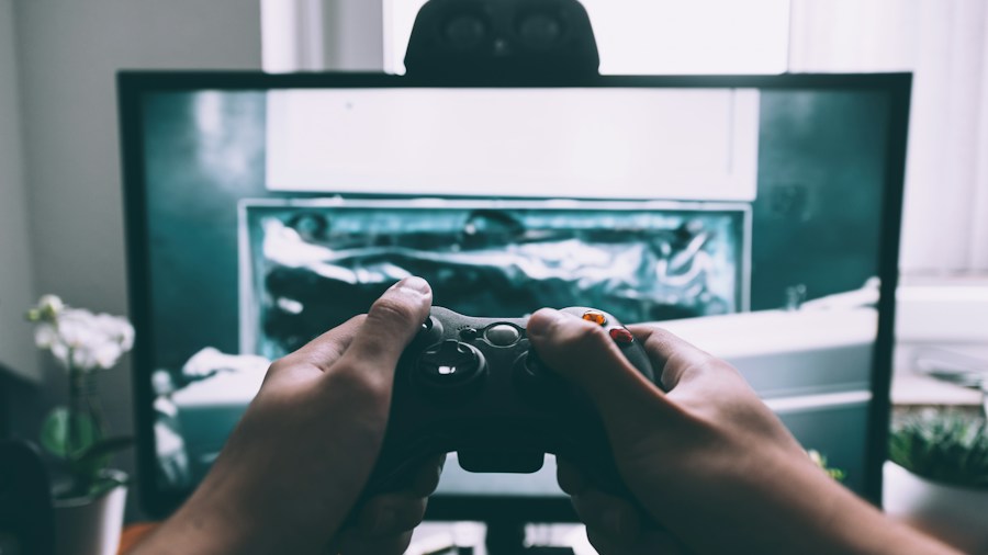 player holding gaming controller