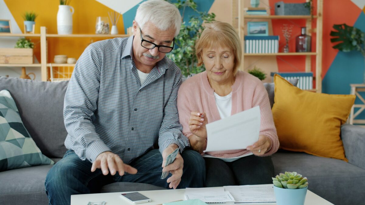 senior couple reviewing healthcare documents