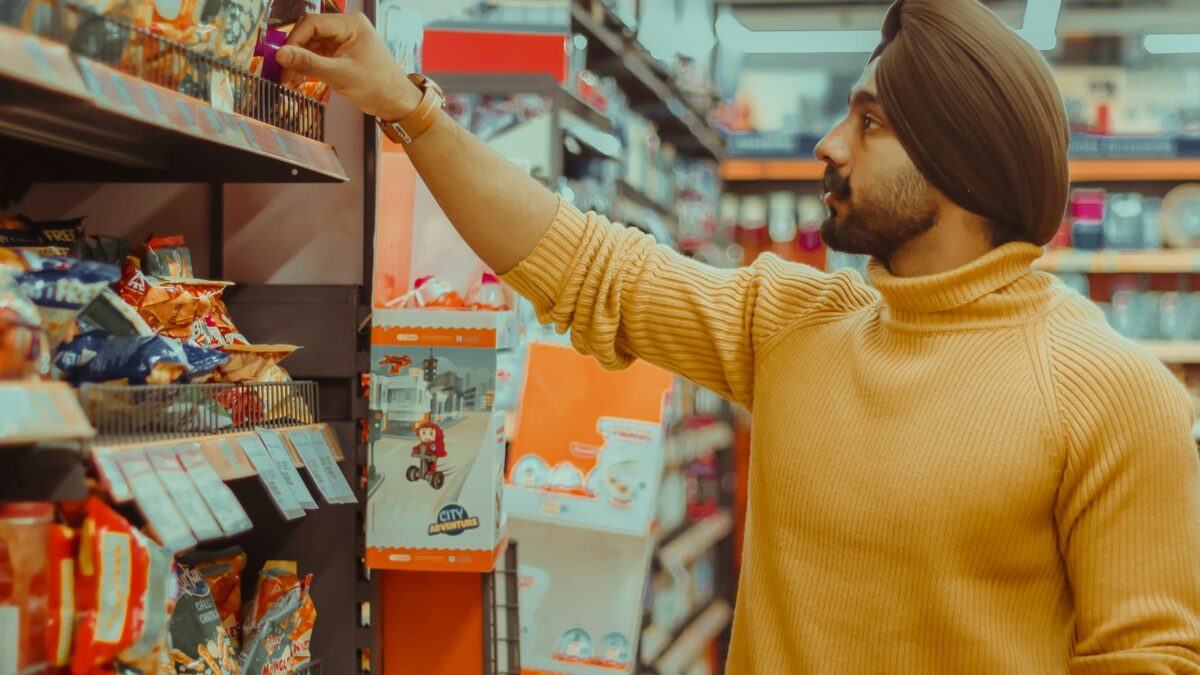 shopper checking grocery prices