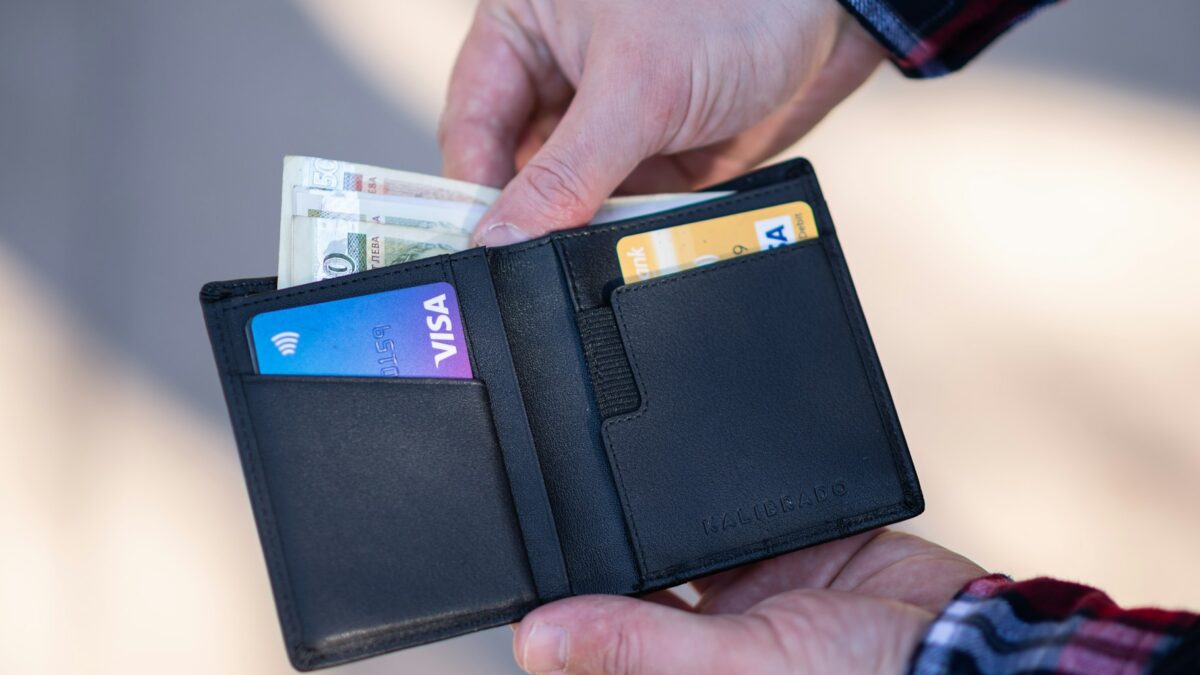 shopper holding wallet in store