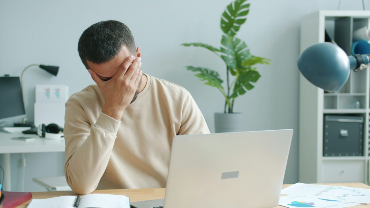 stressed homebuyer reviewing mortgage documents