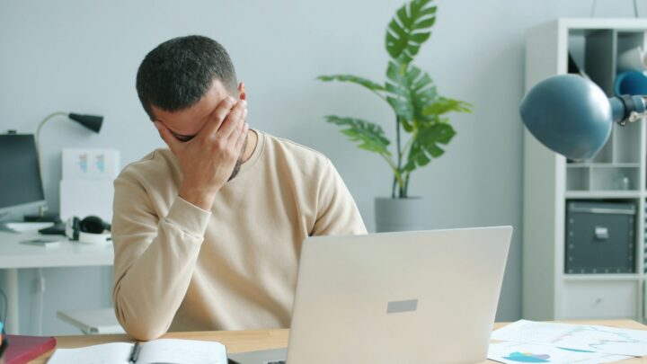 stressed homebuyer reviewing mortgage documents