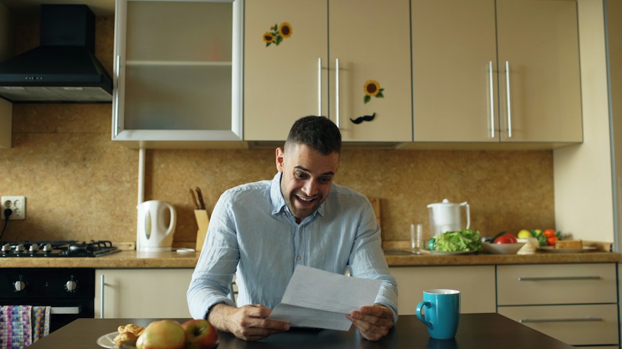 stressed person paying bills at home