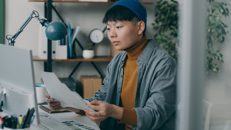 worker reviewing paycheck and bills