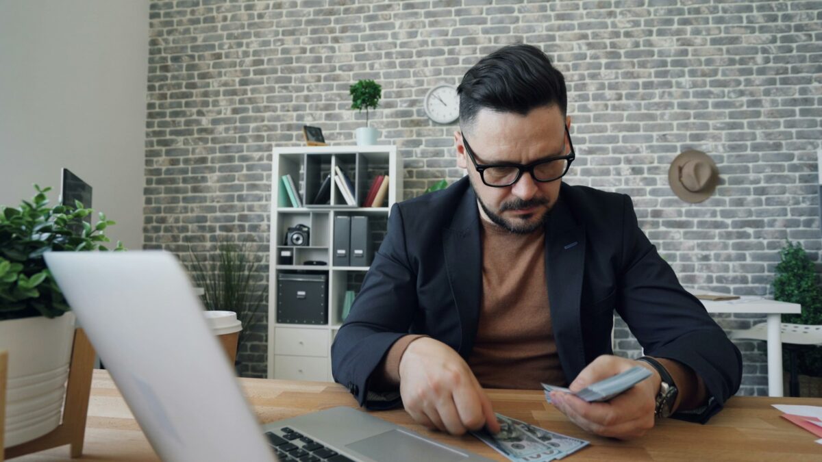 worker reviewing paycheck budget