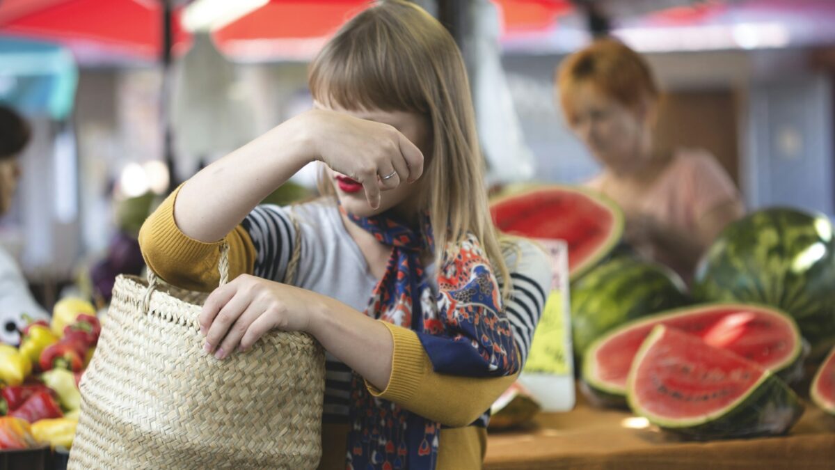 worried shopper checking grocery prices