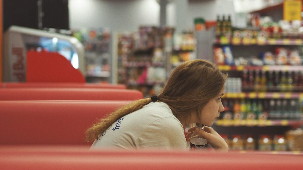 worried shopper checking grocery prices